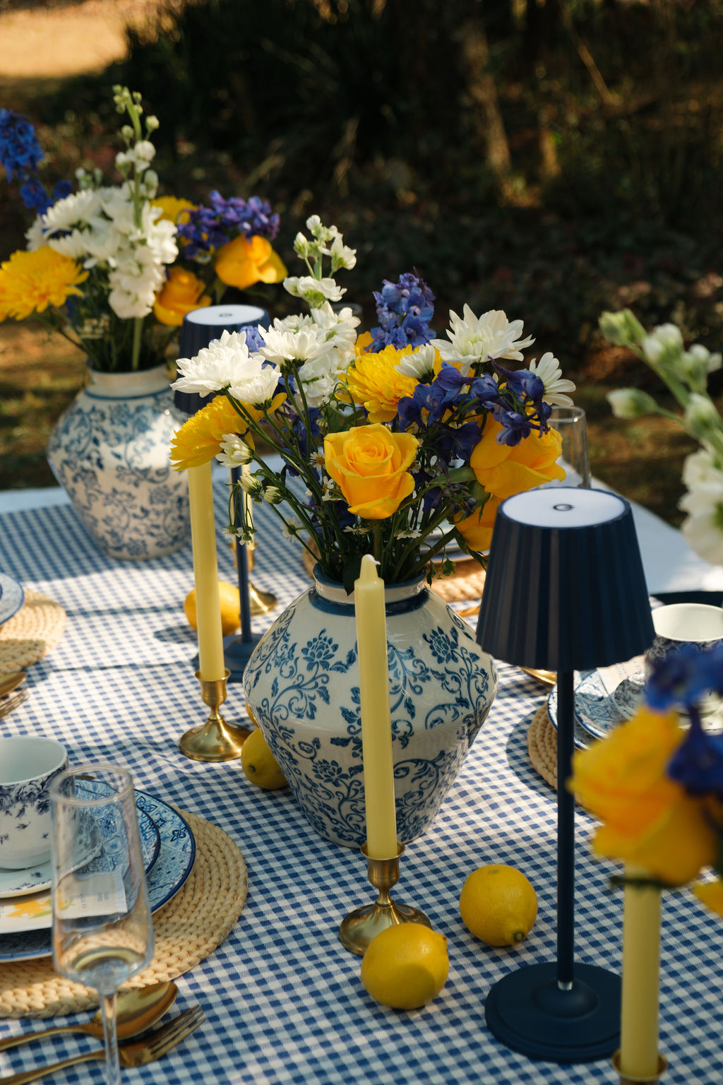 Blue and yellow tablescape with lemons and fresh florals